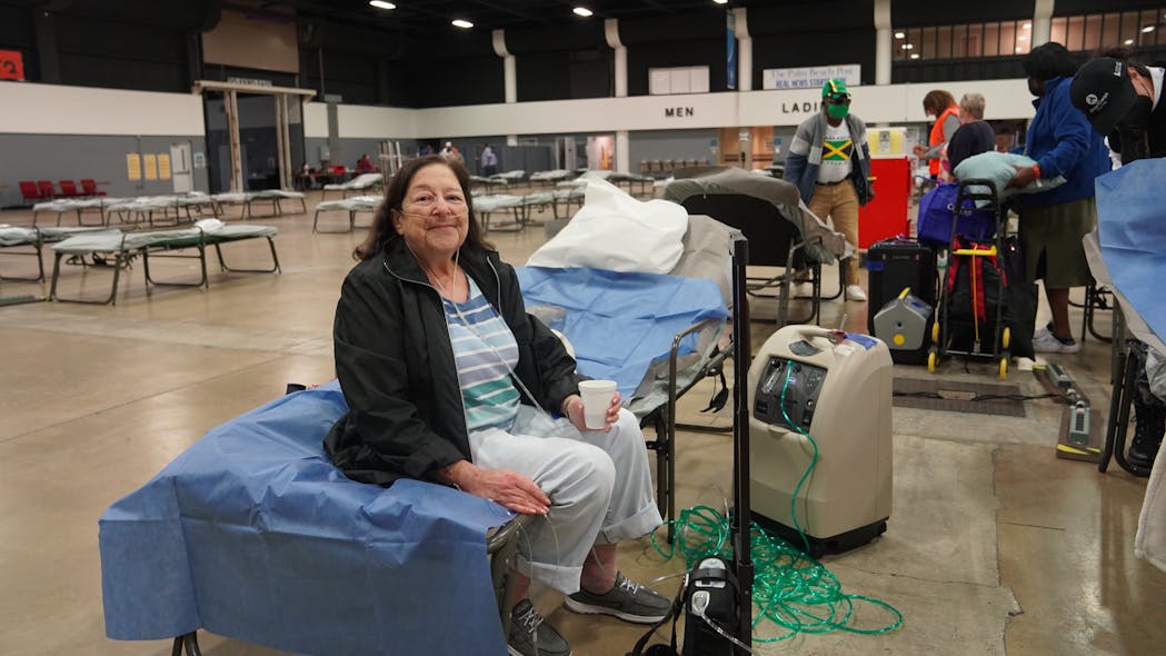 Susan Epstein settling into the Special Needs Center at the South Florida Fair Grounds. She was picked up at her home and transported to the shelter by Palm Tran Connection paratransit service on Wednesday, Nov. 8, 2022.