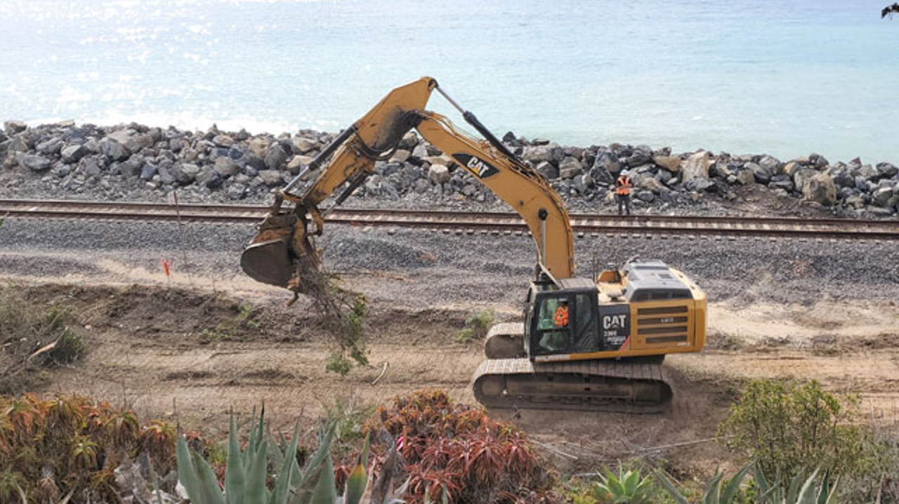 Excavator picking up dirt