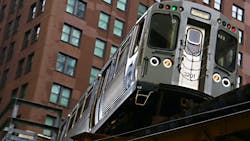 A CTA Brown Line train to Kimball travels on elevated tracks in downtown Chicago. A CTA Brown Line train to Kimball travels on elevated tracks in downtown Chicago.