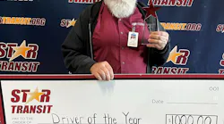 Brock Vawter receiving his $1,000 check for the Star Transit 2022 Driver of the Year.