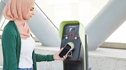 A rider using a PRESTO machine to pay for their transit ride. A rider using a PRESTO machine to pay for their transit ride.
