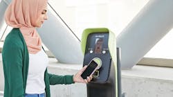 A rider using a PRESTO machine to pay for their transit ride.