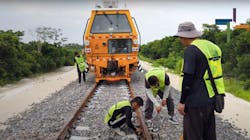 Workers constructing tracks that will serve passenger and freight trains as part of the Mayan Train project being built by the government of Mexico. Workers constructing tracks that will serve passenger and freight trains as part of the Mayan Train project being built by the government of Mexico.