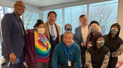 SHA Executive Director Rod Brandon, far left, Seattle Mayor Bruce Harrell, center in light blue tie, and SDOT Director Greg Spotts, in blue jacket, along with Seattle Housing Authority residents celebrated the SHA Transit Pass program on Jan. 24.