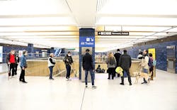 Blind and low visions attendees walk around in the 19th St Oakland Station concourse. Blind and low visions attendees walk around in the 19th St Oakland Station concourse.