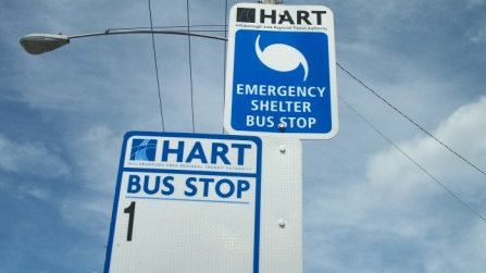 An emergency shelter sign at a HART bus stop in Tampa, Fla.
