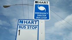 An emergency shelter sign at a HART bus stop in Tampa, Fla.
