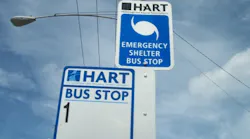 An emergency shelter sign at a HART bus stop in Tampa, Fla.