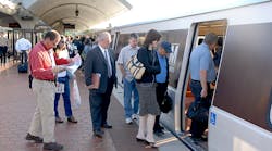 Passengers board a Metrorail Orange Line train.