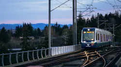 A Link train pulls into Tukwila International Boulevard Station during an evening commute.