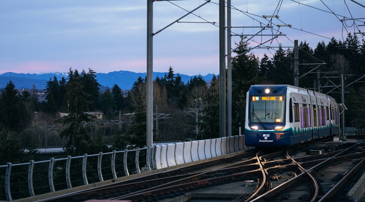 A Link train pulls into Tukwila International Boulevard Station during an evening commute.