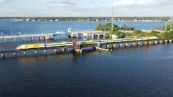 A Brightline train travels across the St. Lucie Railroad Bridge. Rehabilitation work on the bridge was completed in May. A Brightline train travels across the St. Lucie Railroad Bridge. Rehabilitation work on the bridge was completed in May.