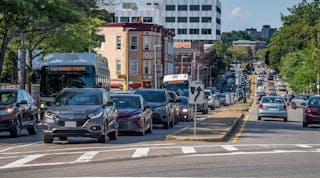 Traffic congestion on Columbus Ave in Jamaica Plain and Roxbury, with multiple MBTA buses stuck behind cars (2020). The authority has been working to install transit signal priority technology on strategic routes to speed bus movements.