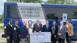 (L to R) Dispatcher/Supervisor Maurice Shelton, Bus Operator Barbette Easley, Pace Director John Noak, Pace Executive Director Melinda J. Metzger, Congressman Bill Foster, Pace Chairman Rick Kwasneski, Bolingbrook Mayor Mary Alexander-Basta, Pace Director Jeff Schielke and Will County Executive Jennifer Bertino-Tarrant receive funding in front of an I-55 Express Bus that will serve the improved facility.