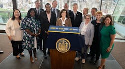 New York Gov. Kathy Hochul, center, with state and regional leaders at an event to mark the FHWA&apos;s issuance of a FONSI for the planned Central Business District Tolling Program in New York City.