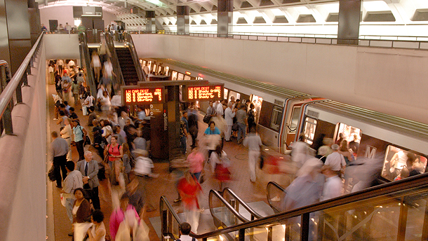 Customers at the Farragut North Metrorail station. Without a solution to its pending financial crisis, WMATA says service could end at 9:30 p.m. and train wait times would be between 20 and 30 minutes starting in FY24.