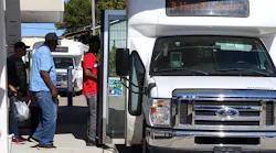 Riders boarding a transit van in Texas.