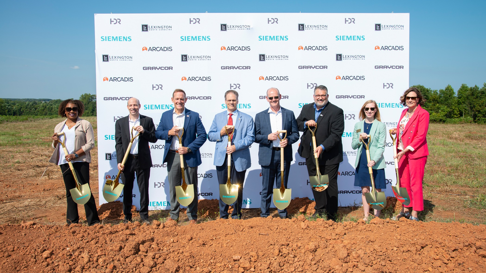 Left to right: Melanie Wallace, Siemens Mobility People & Organization Site Leader, Michael Tyler, President of Customer Services, Siemens Mobility North America, U.S. Senator Ted Budd, State Senator Steve Jarvis, Michael Cahill, President of Rolling Stock, Siemens Mobility North America, Mayor of Lexington, Jason Hayes, Stephanie Blair, Representative of the Office of Senator Tillis, Former City Manager Terra Greene at the Aug. 23 groundbreaking of Siemens Mobility's Lexington, N.C., facility.