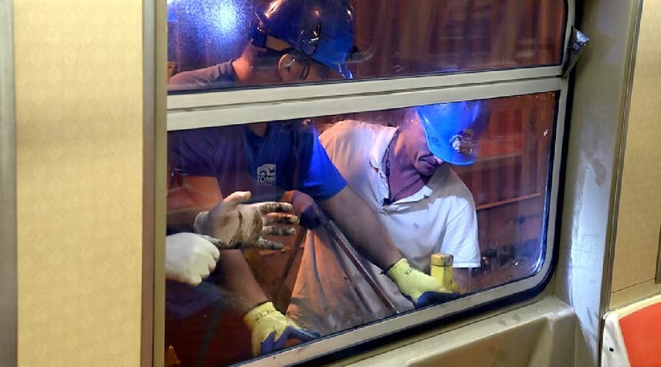 Crews repairing subway windows after vandalism occurred on the B, D, F, N, Q, W and R Lines.