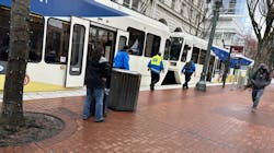 Members of TriMet's Community Safety Team checking a train in downtown Portland, Ore., in April 2023. Members of TriMet's Community Safety Team checking a train in downtown Portland, Ore., in April 2023.