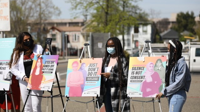 Youth activists with posters at launch of Not One More Girl campaign in 2021.