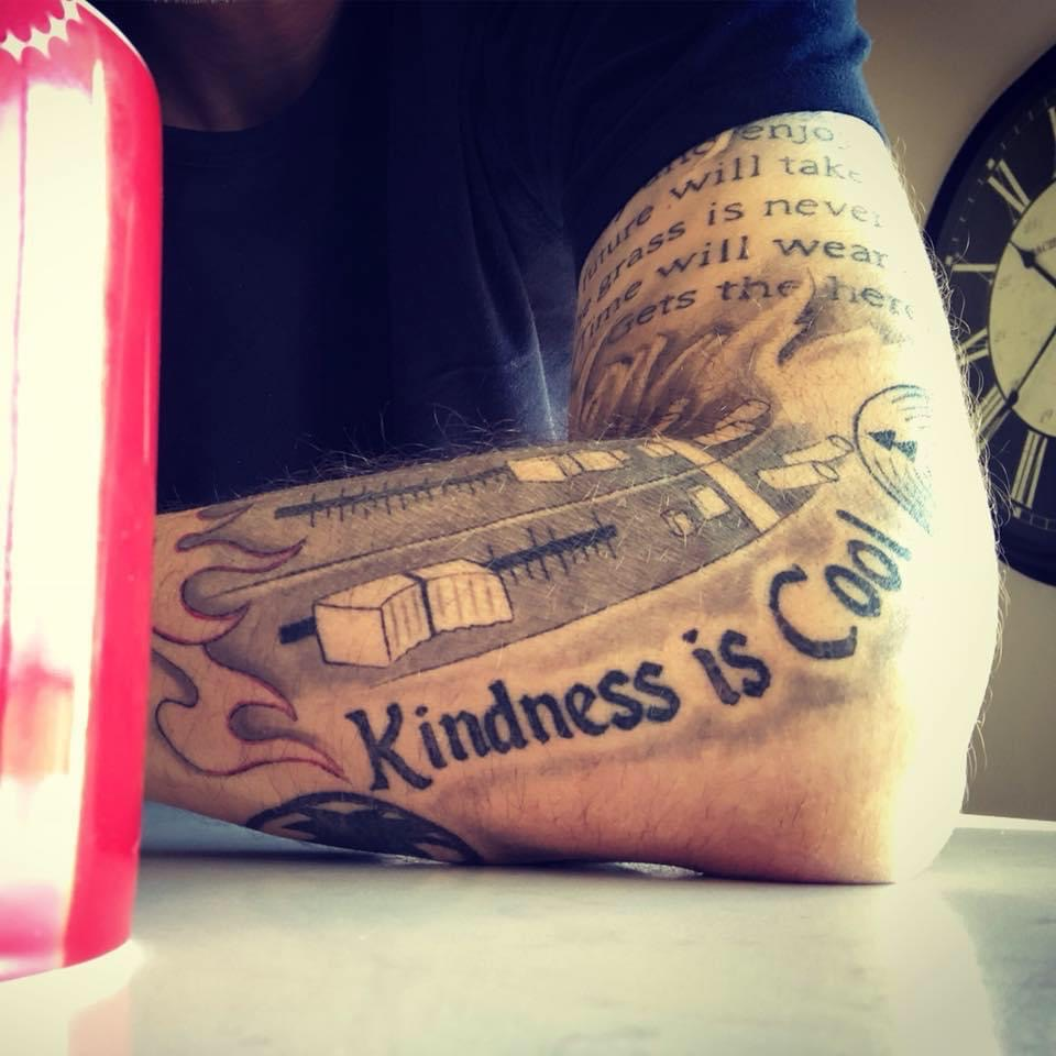 Mike Bismeyer shares the mantra that 'kindness is cool;' he even has the message inked on his arm.