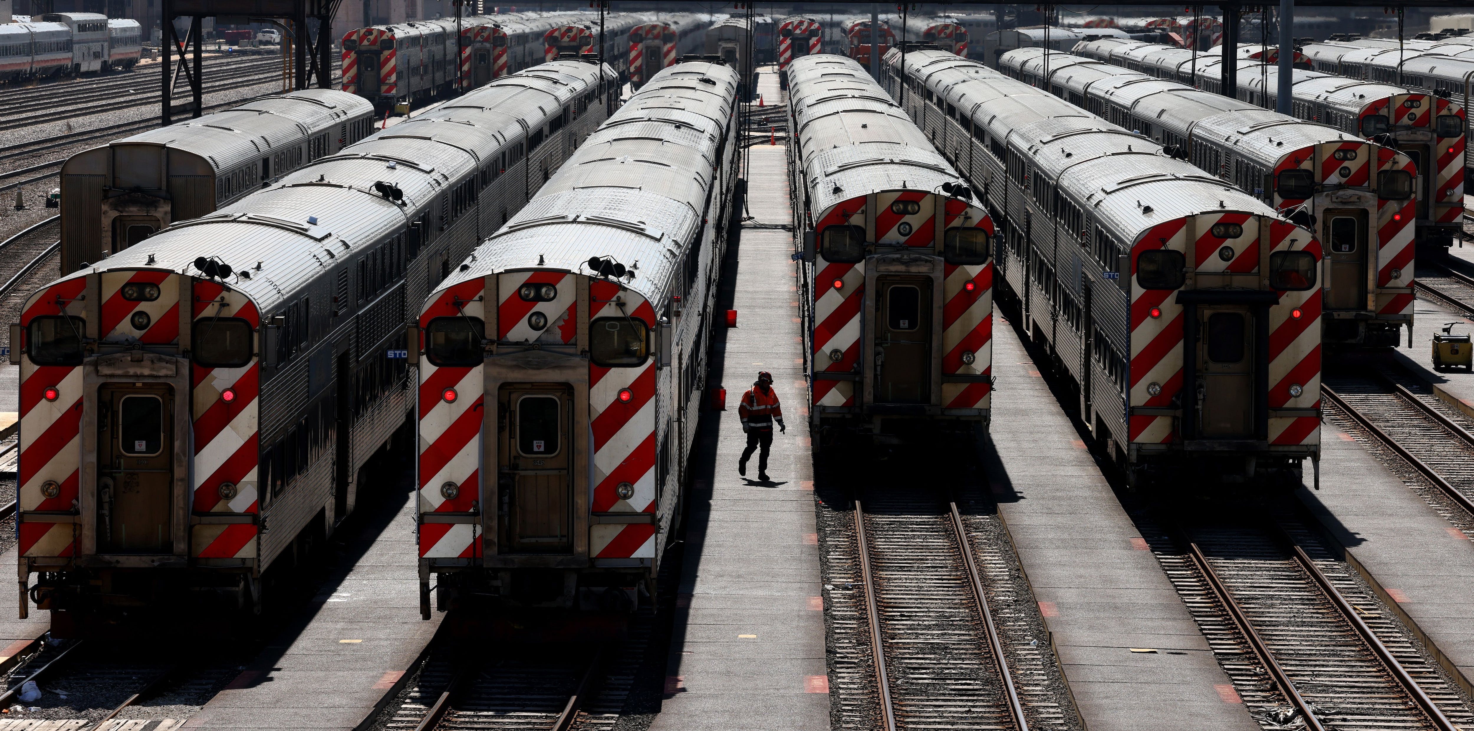 Metra commuter trains in a yard along Roosevelt Road in Chicago on March 20, 2023.