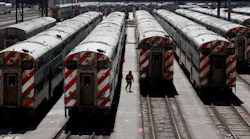 Metra commuter trains in a yard along Roosevelt Road in Chicago on March 20, 2023.