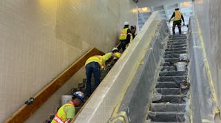 Crews performing in-station work on the stairway areas at JFK/UMass station.
