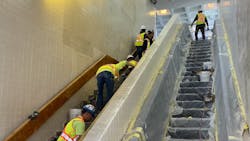 Crews performing in-station work on the stairway areas at JFK/UMass station.