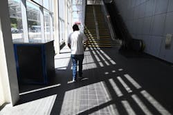 BART intern Erik Huizar studies the tactile guideway at Union City Station on Sept. 6, 2023.