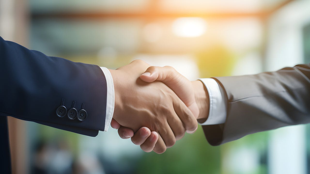 Two people shaking hands.