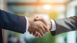 Two people shaking hands. Two people shaking hands.