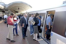File image of passengers boarding a Metrorail Orange Line at New Carrollton station.