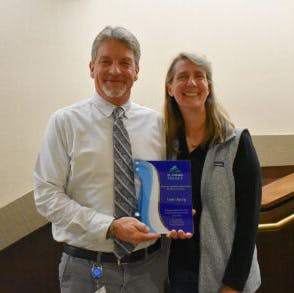 City of Placerville Vice Mayor Jackie Neau, chair of the El Dorado Transit Board of Directors presents Scott with a recognition award for his 30 years of public service.