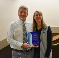 City of Placerville Vice Mayor Jackie Neau, chair of the El Dorado Transit Board of Directors presents Scott with a recognition award for his 30 years of public service. City of Placerville Vice Mayor Jackie Neau, chair of the El Dorado Transit Board of Directors presents Scott with a recognition award for his 30 years of public service.