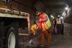 Track crew power washing and removing trash from trackway during Fix It Week night maintenance work. Track crew power washing and removing trash from trackway during Fix It Week night maintenance work.
