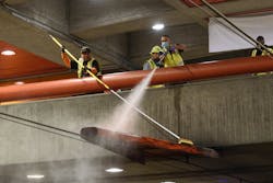 Track crew power washing and removing trash from trackway during Fix It Week night maintenance work. Track crew power washing and removing trash from trackway during Fix It Week night maintenance work.