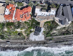 Tarps cover the spot of last week&rsquo;s landslide in San Clemente, CA, on Wednesday, Jan. 31, 2024. The landslide damaged a beach pedestrian bridge and paused rail traffic between Orange and San Diego Counties.