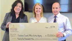Field Hall Foundation Program Officer Patti Horvath (center) presented Dutchess County Executive Sue Serino and OFA Todd Tancredi with a $25,000 grant to expand the OFA&apos;s GoGo Grandparent program.