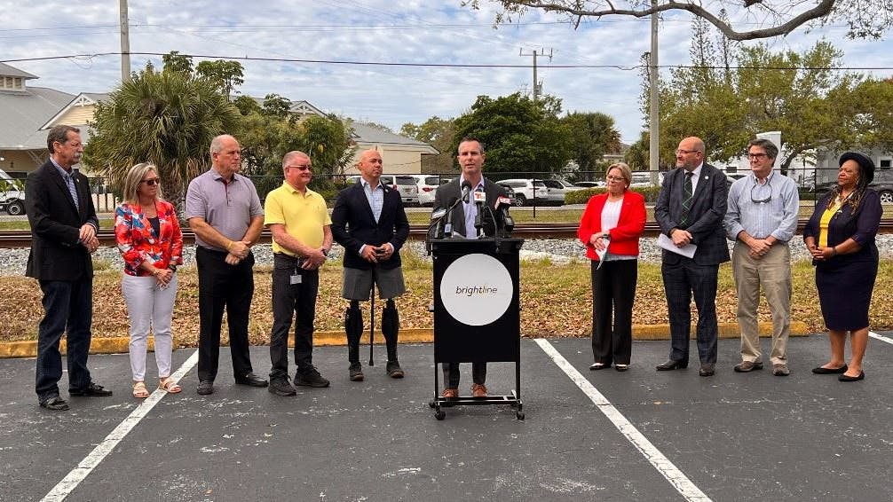 Brian Kronberg, senior vice president of development for Brightline, is joined by city and state officials at an event announcing Stuart, Fla., will be the location of Brightline's newest station. The city is known as the 'Sailfish Capital of the World.'