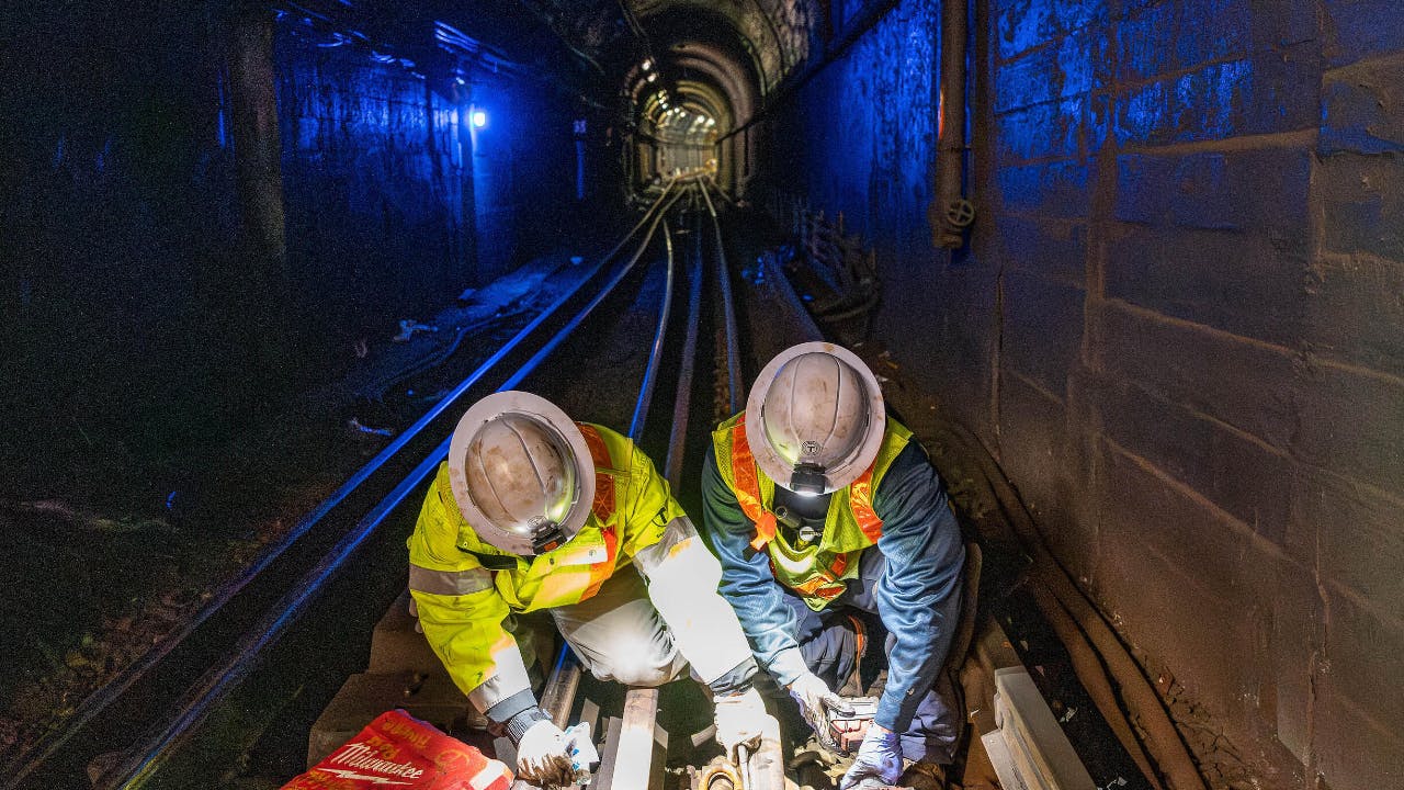 Crews performed track work in the underground tunnel of the Orange Line.