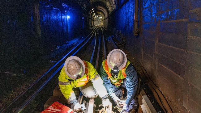 Crews performed track work in the underground tunnel of the Orange Line.