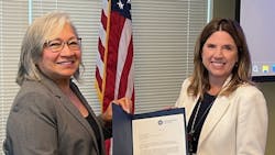 Sonya Proctor (left), TSA assistant administrator for surface operations, presents the TSA Gold Standard Award for security to LYNX CEO Tiffany Homler Hawkins (right) at a ceremony in Orlando, Fla., on April 3..