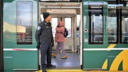 Metro Transit Police Chief Ernest Morales III watches as riders enter and exit the Green Line light rail train in St. Paul on Tuesday, Feb. 13, 2024. Morales and his team are working to improve public safety issues on the Green Line.