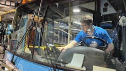 Matthew Rosenbloom-Jones in the driver’s seat demonstrating a farebox to a Cornell student who is designing informational materials to help Tompkins County newcomers with limited English proficiency to navigate TCAT’s system. Matthew Rosenbloom-Jones in the driver’s seat demonstrating a farebox to a Cornell student who is designing informational materials to help Tompkins County newcomers with limited English proficiency to navigate TCAT’s system.