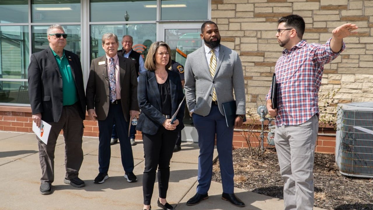 Anthony Taylor, MVTA manager, Infrastructure and Capital Projects, discusses plans for improvements at Rosemount Transit Station with, from left, Rosemount Mayor Jeff Weisensel; Dan Kealey, chair of the MVTA Board of Commissioners; U.S. Rep. Angie Craig (D-MN-2), and MVTA CEO Luther Wynder.