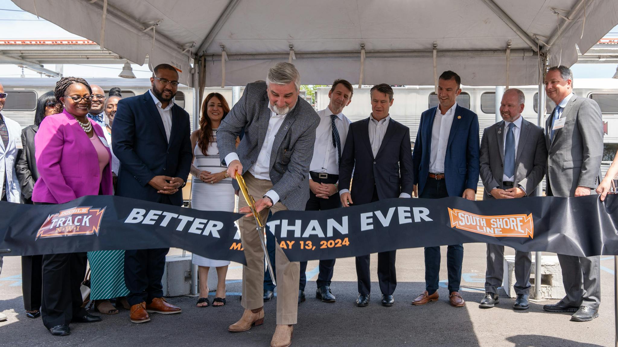 Indiana Gov. Eric Holcomb cuts the ribbon on the NICTD Double Track Northwest Indiana project. The double track project will allow NICTD to run 14 additional weekday trains on the South Shore Line.