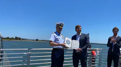 Captain Taylor Q. Lam presents Pace Ralli, CEO of SWITCH Maritime, with signed Certificate of Inspection.