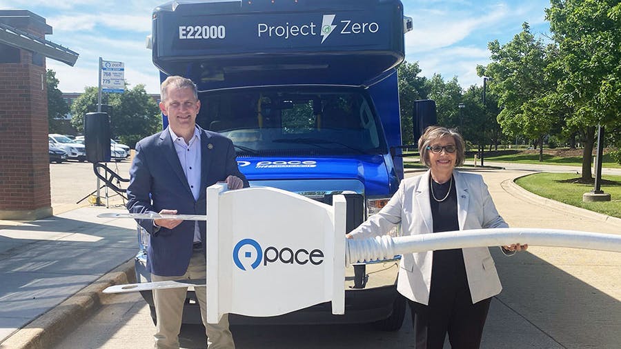 U.S. Rep. Sean Casten (D-IL-6) and Pace Executive Director Melinda Metzger in front of Pace&rsquo;s first electric paratransit bus.